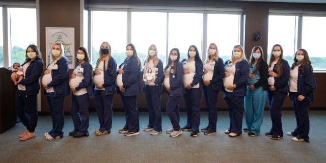 From left to right: Mariah Lockler, Caitlin Hall, Shannon Diffey, Elizabeth Puett, Lindsey Mallinson, Allison Landes, Shamille Mack (pictured in a black and white photo held by Landes), Sierra Fischer, Elizabeth Spicher, Ellie Kongs, Melissa Burgess, Danielle Best, Dr. Susie Ezell and Stephanie Lynch.