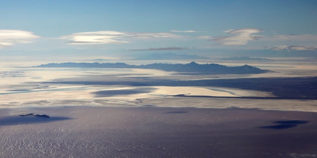 The salt covered lake bed and saline waters of the Great Salt Lake are pictured from north of Salt Lake City, Utah, April 14, 2020. 