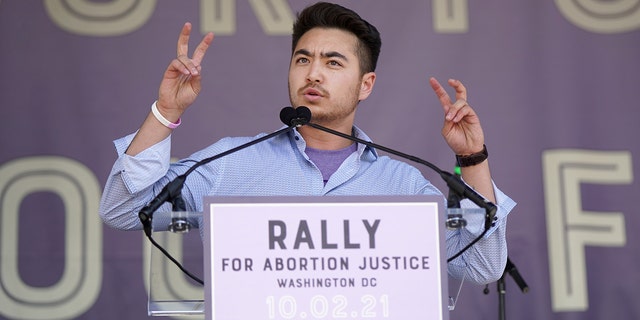 Schuyler Bailar speaks onstage at the Rally For Abortion Justice Oct. 2, 2021, in Washington, D.C.