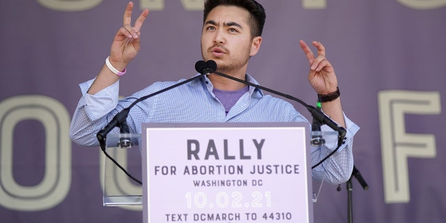 Schuyler Bailar speaks onstage at the Rally For Abortion Justice Oct. 2, 2021, in Washington, D.C.