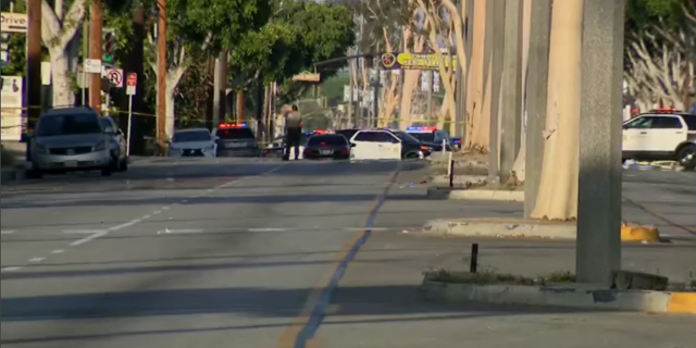 Police investigate after two El Monte Police Department officers were shot Tuesday.