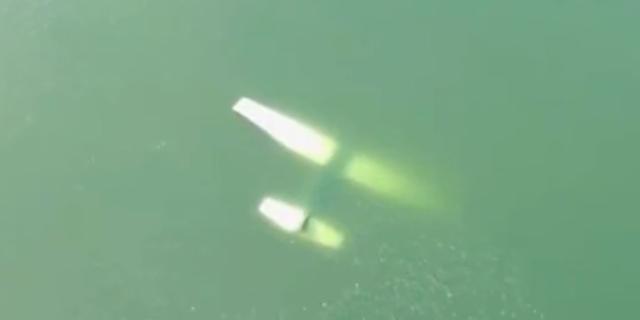 This drone footage from the Austin-Travis County EMS shows the plane submerged underwater. 