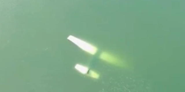 This drone footage from the Austin-Travis County EMS shows the plane submerged underwater.