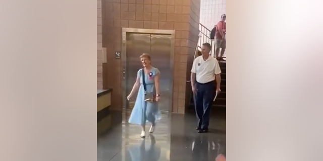 Steelman exits her school on the last day of her 50-year teaching career. (TikTok/@katherinemanhattan)