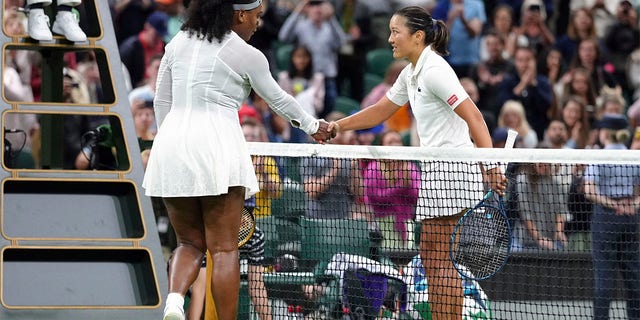 Serena Williams of the US greets France's Harmony Tan at the net after losing to her in a first round women’s singles match on day two of the Wimbledon tennis championships in London, Tuesday, June 28, 2022. 