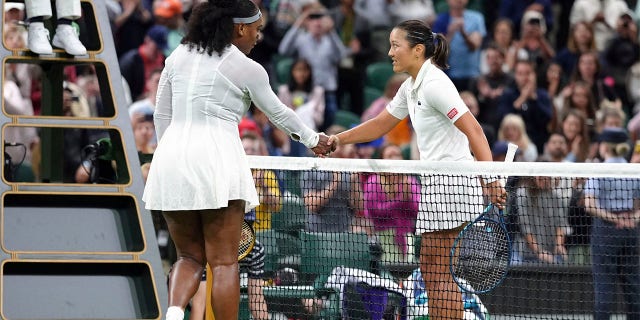 Serena Williams of the US greets France's Harmony Tan at the net after losing to her in a first round women’s singles match on day two of the Wimbledon tennis championships in London, Tuesday, June 28, 2022. 