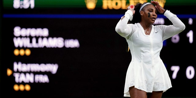 Serena Williams of the US reacts as she plays France's Harmony Tan in a first round women’s singles match on day two of the Wimbledon tennis championships in London, Tuesday, June 28, 2022.