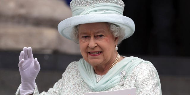 Queen Elizabeth II waves as she leaves a Service Of Thanksgiving at St Paul's Cathedral on the 60th anniversary of her ascension to the British throne.