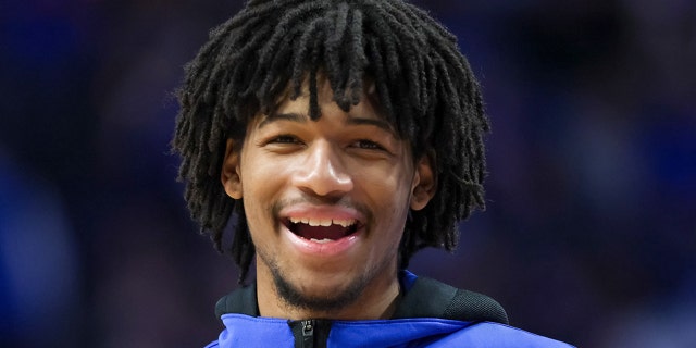 Shaedon Sharpe #21 of the Kentucky Wildcats looks on during halftime against the Florida Gators at Rupp Arena on Feb. 12, 2022 in Lexington, Kentucky.