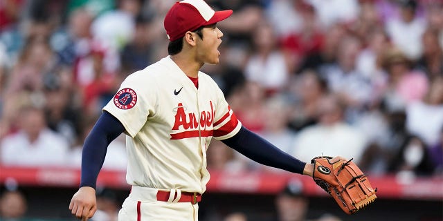 Los Angeles Angels starting pitcher Shohei Ohtani reacts after striking out Chicago White Sox's Luis Robert during the first inning of a baseball game Wednesday, June 29, 2022, in Anaheim, Calif. 