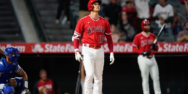 Los Angeles Angels designated hitter Shohei Ohtani (17) reacts after hitting a home run during the ninth inning of a baseball game against the Kansas City Royals in Anaheim, Calif., Tuesday, June 21, 2022. Mike Trout and Tyler Wade also scored.
