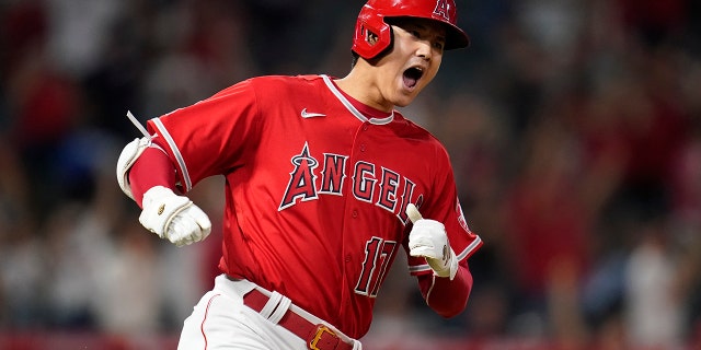 Los Angeles Angels designated hitter Shohei Ohtani (17) reacts after hitting a home run during the ninth inning of a baseball game against the Kansas City Royals in Anaheim, Calif., Tuesday, June 21, 2022. Mike Trout and Tyler Wade also scored.