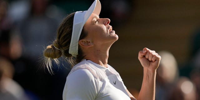 Romania's Simona Halep gestures as she play Belgium's Kirsten Flipkens in a second round women's single match on day four of the Wimbledon tennis championships in London, Thursday, June 30, 2022.