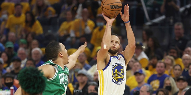 Golden State Warriors guard Stephen Curry (30) shoots against the Boston Celtics during the first half of Game 2 of the NBA Basketball Finals in San Francisco, Sunday, June 5, 2022.