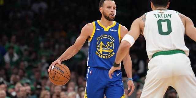 Jayson Tatum of the Celtics plays defense on Stephen Curry of the Golden State Warriors during Game Six of the 2022 NBA Finals on June 16, 2022, at TD Garden in Boston, Massachusetts.