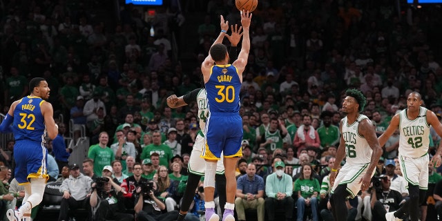 Stephen Curry #30 of the Golden State Warriors shoots a three point basket against the Boston Celtics during Game Six of the 2022 NBA Finals on June 16, 2022 at TD Garden in Boston, Massachusetts.