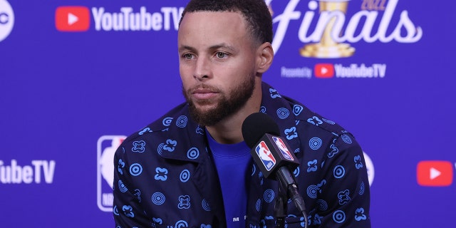Stephen Curry of the Golden State Warriors talks to the media after the NBA Finals game on June 5, 2022.