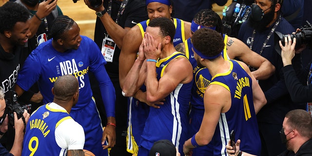 Stephen Curry #30 of the Golden State Warriors celebrates with teammates after defeating the Boston Celtics 103-90 in Game Six of the 2022 NBA Finals at TD Garden on June 16, 2022 in Boston, Massachusetts.