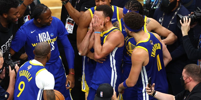 Stephen Curry #30 of the Golden State Warriors celebrates with teammates after defeating the Boston Celtics 103-90 in Game Six of the 2022 NBA Finals at TD Garden on June 16, 2022 in Boston, Massachusetts.