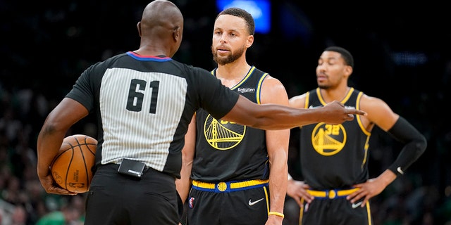 Golden State Warriors guard Stephen Curry reacts to referee Courtney Kirkland during the NBA Finals in Boston against the Celtics, Wednesday, June 8, 2022.