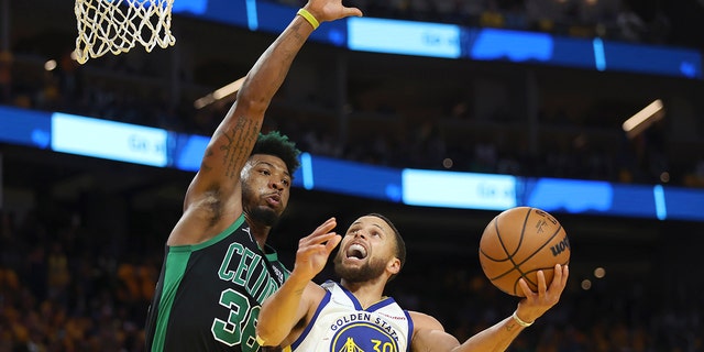 Golden State Warriors Guard Stephen Curry, 30, will face Boston Celtics Guard Marcus Smart in the second half of Game 5 of the NBA Finals basketball in San Francisco on Monday, June 13, 2022.