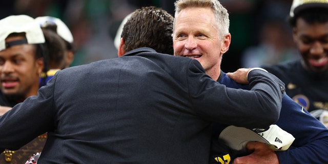 General manager Bob Myers of the Golden State Warriors hugs head coach Steve Kerr after defeating the Boston Celtics 103-90 in Game Six of the 2022 NBA Finals at TD Garden on June 16, 2022 in Boston, Massachusetts.