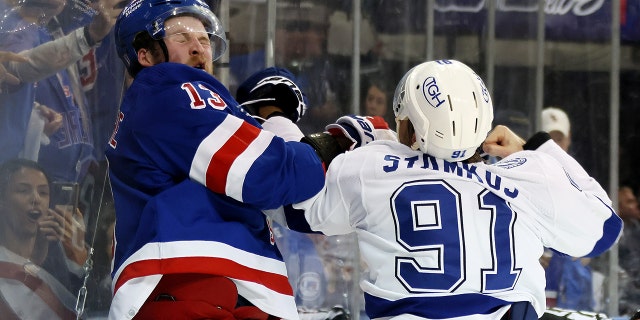 Steven Stamkos #91 of the Tampa Bay Lightning fights with Alexis Lafrenière #13 of the New York Rangers at the end of the third period in Game Five of the Eastern Conference Final of the 2022 Stanley Cup Playoffs at Madison Square Garden on June 9, 2022 in New York City.