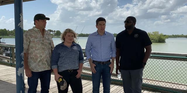 Reps. Brian Stiel, R-Wis., Jodey Arrington, R-Texas, Kat Cammack, R-Fla., and Byron Donalds, R-Fla., speak to reporters after touring the Rio Grande with the Texas Department of Public Safety. 