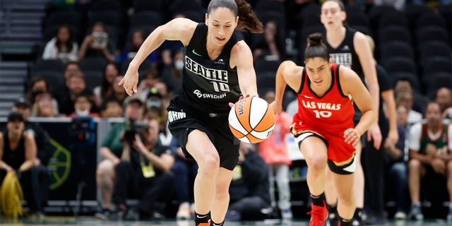 Sue Bird #10 of the Seattle Storm steals the ball from Kelsey Plum #10 of the Las Vegas Aces during the first half at Climate Pledge Arena on June 29, 2022 in Seattle, Washington. 