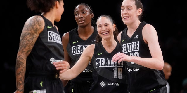 Seattle Storm guard Sue Bird (10) celebrates with teammates after scoring a 3-point goal during the final seconds of the second half of a WNBA basketball game against the New York Liberty, Sunday, June 19, 2022, in New York. 