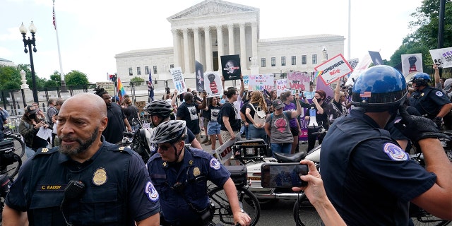 People protest about abortion, Friday, June 24, 2022, outside the Supreme Court in Washington. 