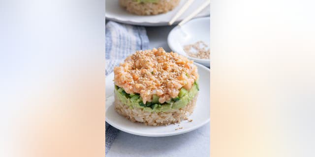 Popular TikTok account and digital food media company Feel Good Foodie is making sushi stack recipes trend on the video-sharing app again with their sushi shrimp stack creation, which is inspired by a similar recipe that cookbook author Gina Homolka made in 2020.