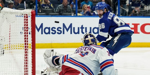 New York Rangers goaltender Igor Shesterkin (31) makes the save against Tampa Bay Lightning right wing Nikita Kucherov (86) during the second period in Game 6 of the NHL hockey Stanley Cup playoffs Eastern Conference finals, Saturday, June 11, 2022, in Tampa, Fla. (AP Photo/Chris O'Meara)