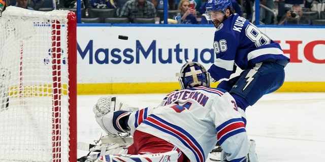 New York Rangers goaltender Igor Shesterkin (31) makes the save against Tampa Bay Lightning right wing Nikita Kucherov (86) during the second period in Game 6 of the NHL hockey Stanley Cup playoffs Eastern Conference finals, Saturday, June 11, 2022, in Tampa, Fla. (AP Photo/Chris O'Meara)
