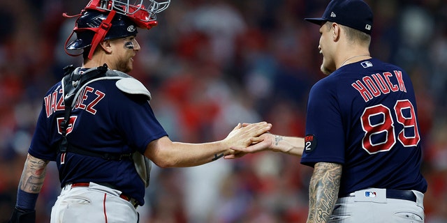 Boston Red Sox catcher Christian Vazquez and relief pitcher Tanner Houck celebrate their win over the Guardians on Friday, June 24, 2022, in Cleveland.
