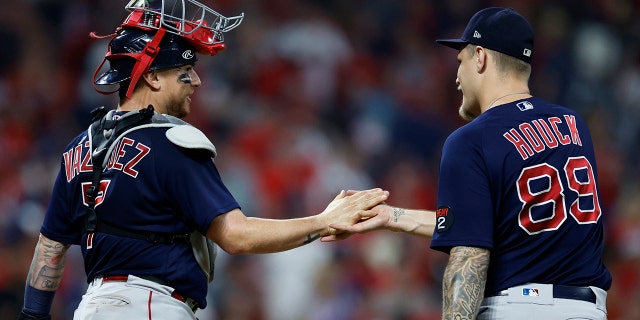 Boston Red Sox catcher Christian Vazquez and relief pitcher Tanner Houck celebrate their win over the Guardians on Friday, June 24, 2022, in Cleveland.