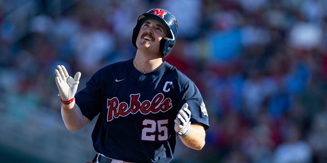 Mississippi's Tim Elko (25) runs the bases after hitting a home run against Arkansas in the first inning during an NCAA College World Series baseball game, Monday, June 20, 2022, in Omaha, Neb. 