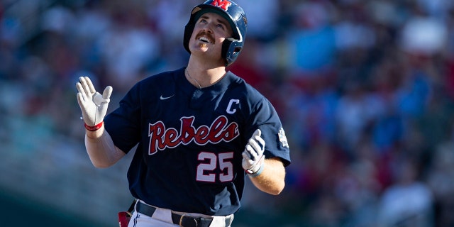 Mississippi's Tim Elko (25) runs the bases after hitting a home run against Arkansas in the first inning during an NCAA College World Series baseball game, Monday, June 20, 2022, in Omaha, Neb. 