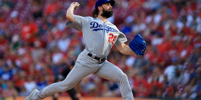 Los Angeles Dodgers' Tony Gonsolin throws during the first inning of a baseball game against the Cincinnati Reds in Cincinnati, Tuesday, June 21, 2022.