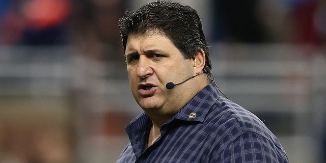 Fox Sports field reporter Tony Siragusa works the sidelines during a game between the Chicago Bears and the Detroit Lions at Ford Field Dec. 30, 2012, in Detroit.