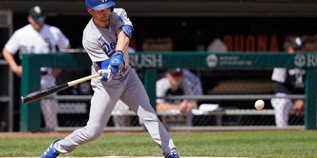 Los Angeles Dodgers' Trea Turner morphs into an RBI single off the Chicago White Sox starting pitcher Dylan Cease during the fifth inning of a baseball game on Thursday, June 9, 2022 in Chicago.