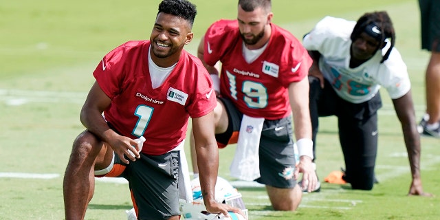 Miami Dolphins quarterback Tua Tagovailoa (1) takes part in drills at the team's practice facility June 2, 2022, in Miami Gardens, Fla.
