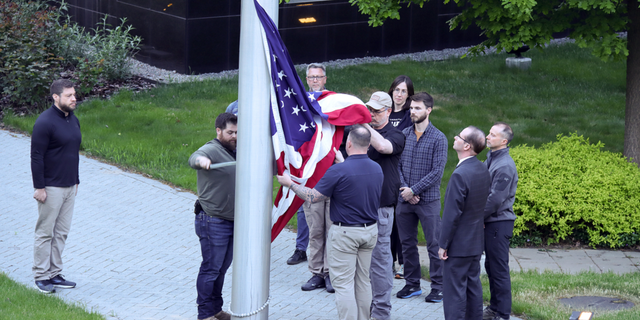 The American flag is raised outside the U.S. Embassy in Kyiv, Ukraine, on May 18.