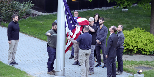 The American flag is raised outside the U.S. Embassy in Kyiv, Ukraine, on May 18.