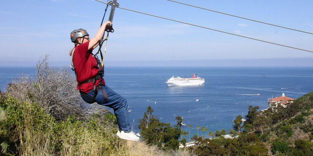 Marie Kuhnla on a zip-line.