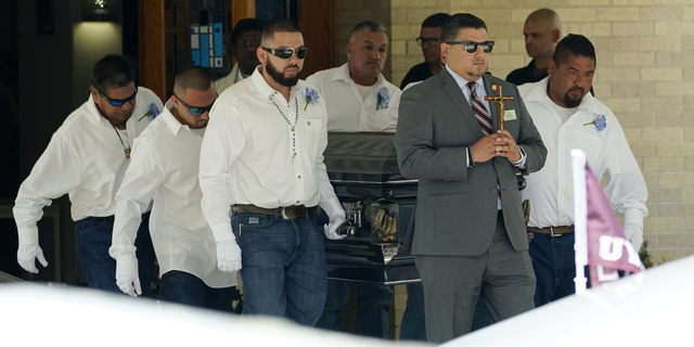 Pallbearers carry the casket of Jose Flores Jr., 10, after a funeral service at Sacred Heart Catholic Church on Wednesday, June 1, in Uvalde, Texas. Flores was killed in last week's elementary school shooting. 