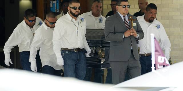 Pallbearers carry the casket of Jose Flores Jr., 10, after a funeral service at Sacred Heart Catholic Church on Wednesday, June 1, in Uvalde, Texas. Flores was killed in last week's elementary school shooting.
