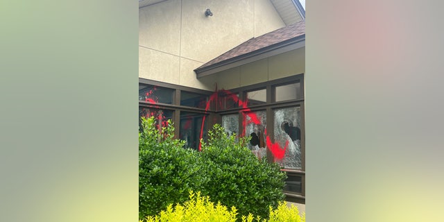 Red paint splattered across the broken windows of the Mountain Pregnancy Services building in Asheville, North Carolina, on June 7, 2022.