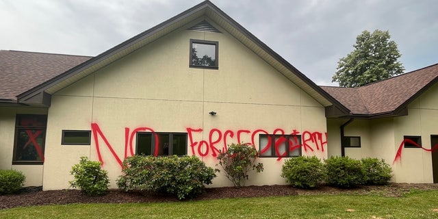 "No forced births!" scrawled on the side of the vandalized Mountain Area Pregnancy Services building in Asheville, North Carolina, on June 7, 2022.
