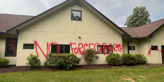 "No forced births!" scrawled on the side of the vandalized Mountain Area Pregnancy Services building in Asheville, North Carolina, on June 7, 2022.